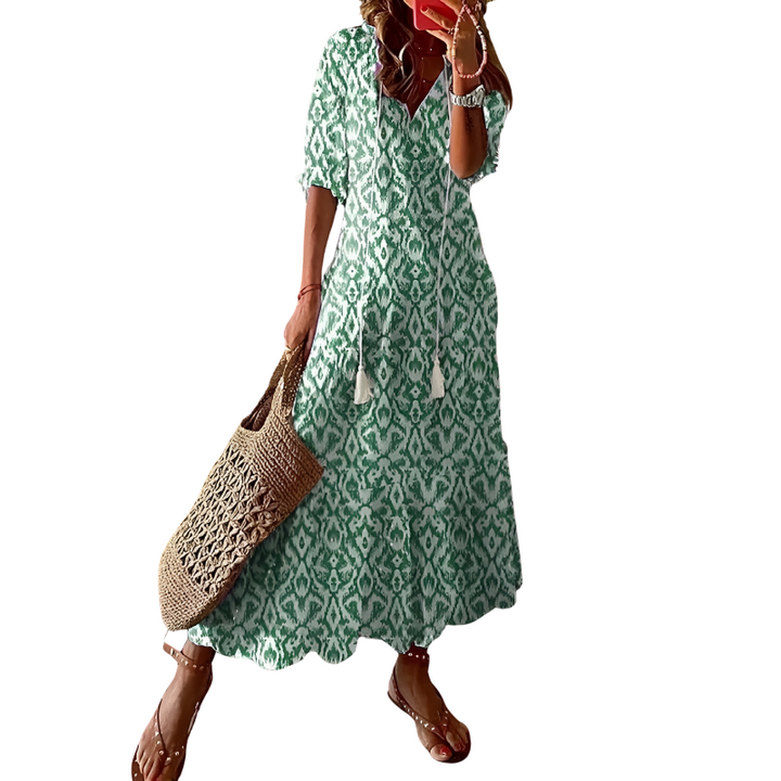 Elegant women's summer floral maxi dress, bohemian style. Ideal for beachwear, vacations, and casual outings.