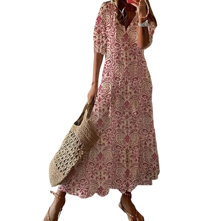 Long flowy floral maxi dress for women, featuring a vibrant bohemian pattern. A comfortable summer fashion choice.
