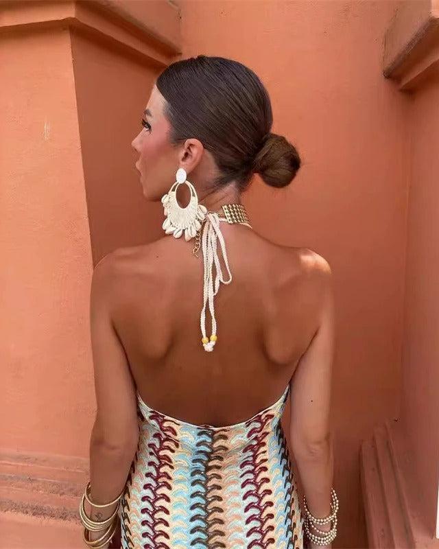 Bohemian style women's beige crochet beach dress for vacation, a relaxed fit and chic summer outfit.