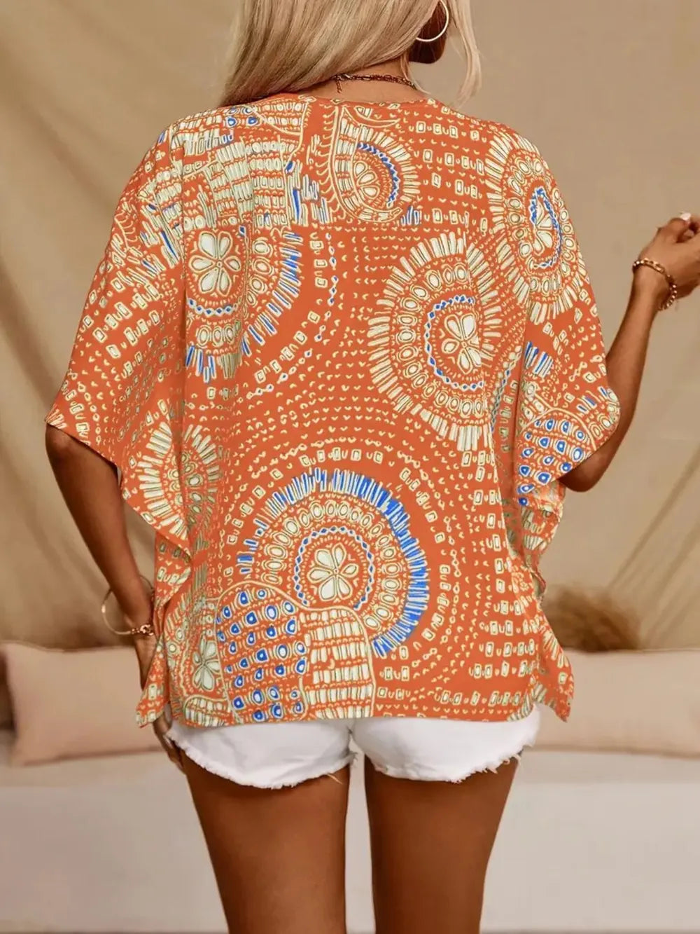 Lightweight women's boho blouse, V-neck, attractive printed pattern, casual chic style.