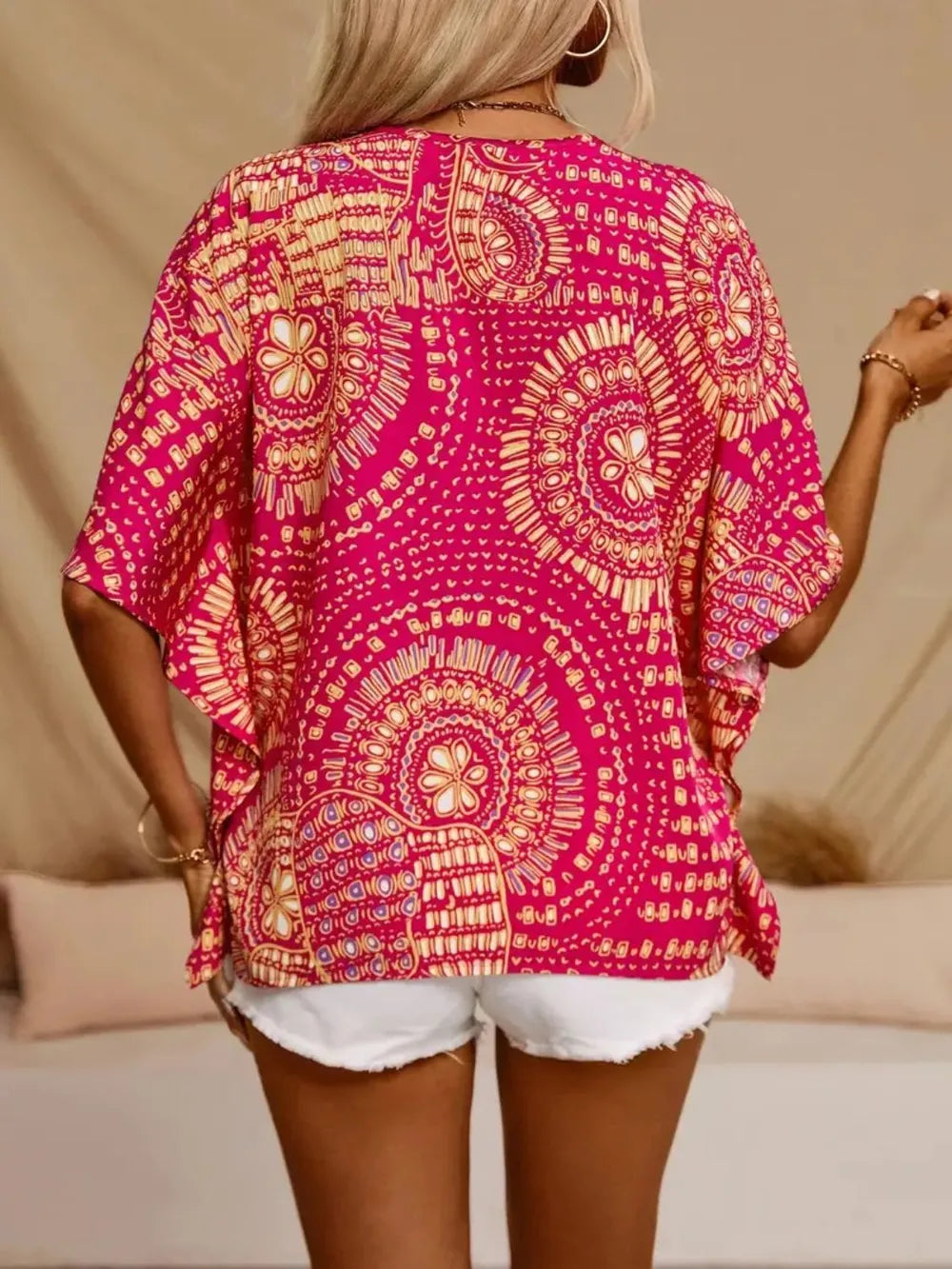 Lightweight printed V-neck blouse for women, casual summer style with ethnic patterns.