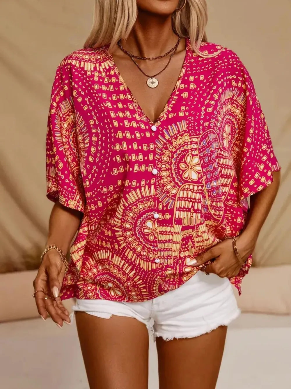 Flowy women's blouse, bohemian V-neck with eye-catching print, lightweight fabric.