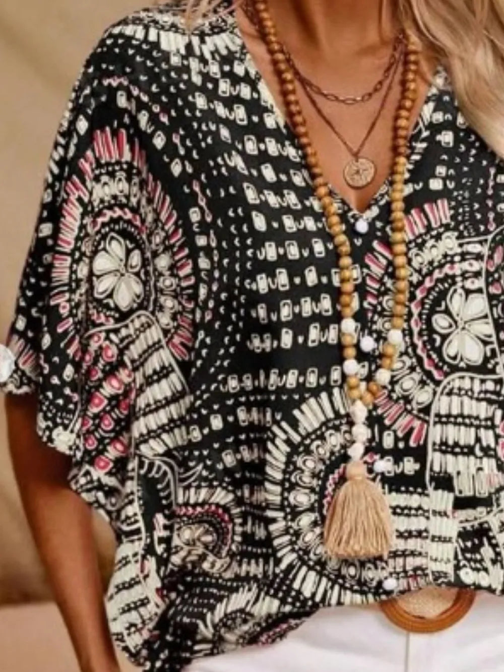 Printed V-neck women's top, relaxed fit, stylish bohemian pattern, chic and lightweight.