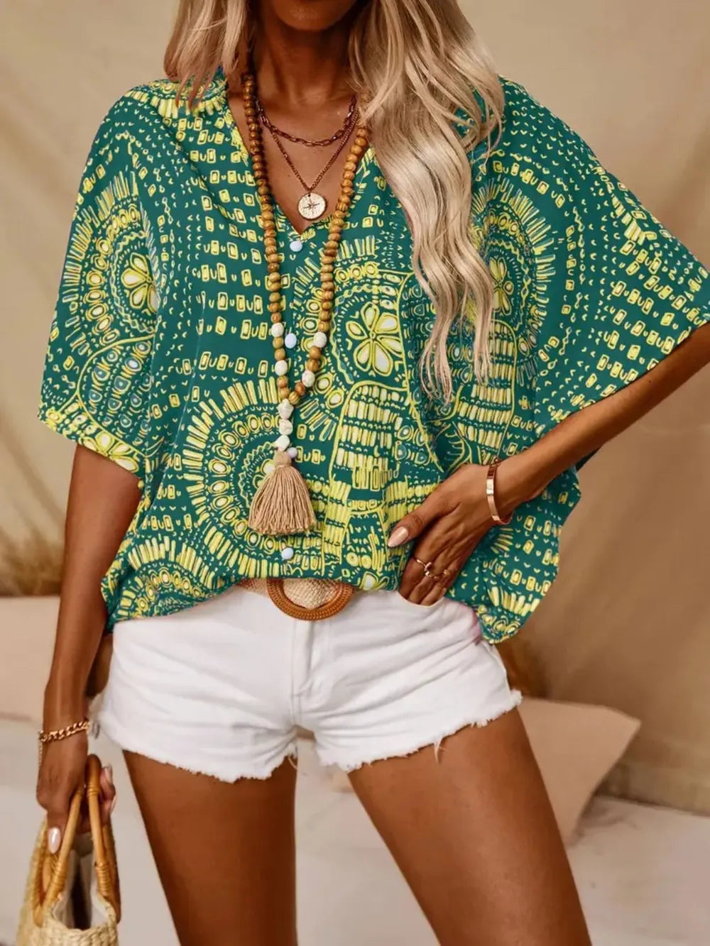 Women's elegant V-neck blouse, bohemian printed design, lightweight and breathable.