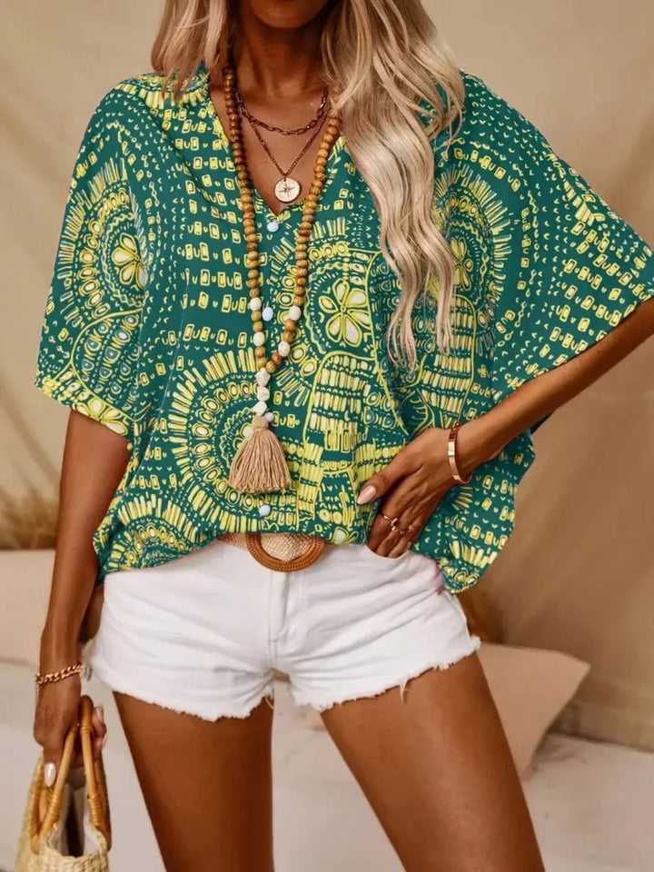 Women's elegant V-neck blouse, bohemian printed design, lightweight and breathable.