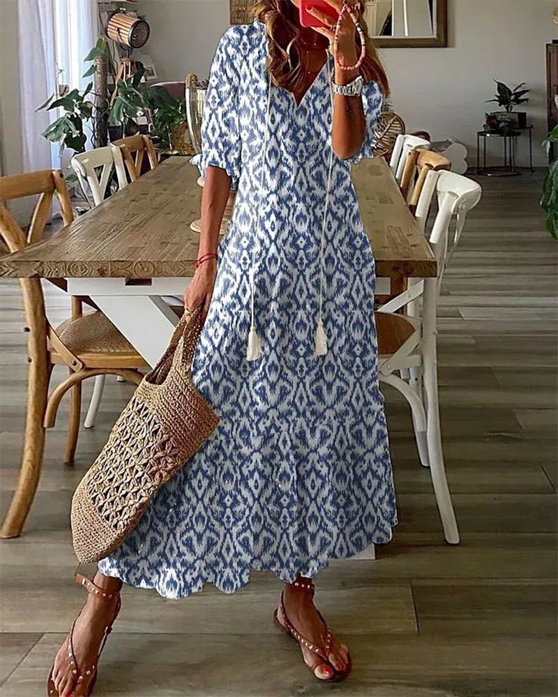 Women's boho vintage V-neck maxi dress with unique print, perfect for summer casual or spring fashion.