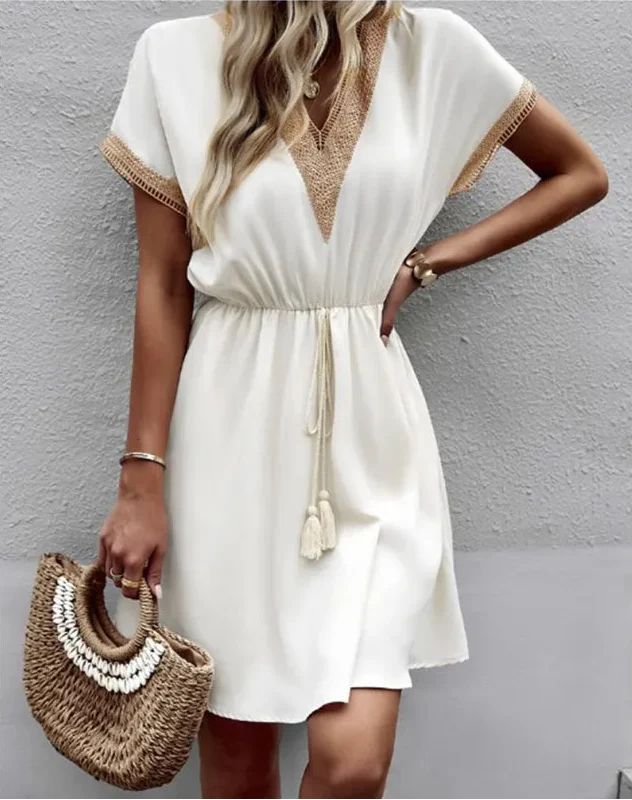 Women's Boho white mini dress with V-neck, drawstring, and short sleeves, perfect for summer beach or casual resort wear.