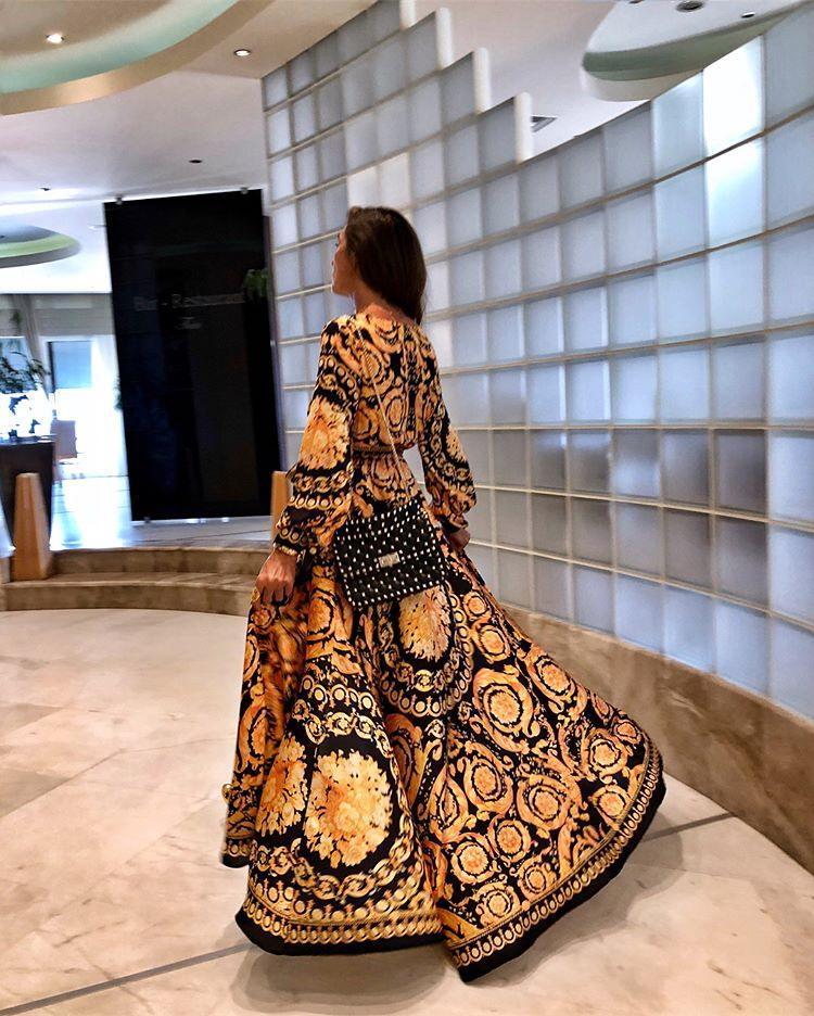 Beautiful women's boho summer dress, a long sleeve wrap design with a graceful slit.