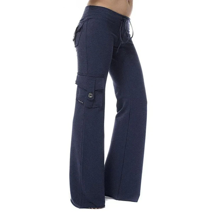 Durable women's bootcut cargo pants, designed for travel and outdoor activities with pockets.