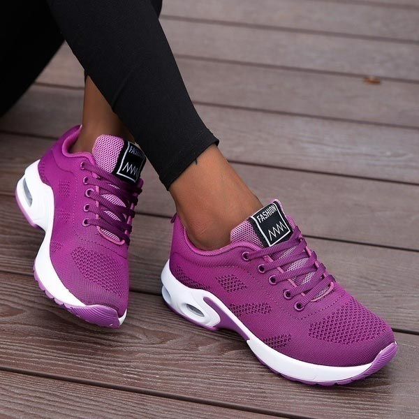 Pair of women's all-season comfort sneakers, offering breathable support for daily activities & walking.