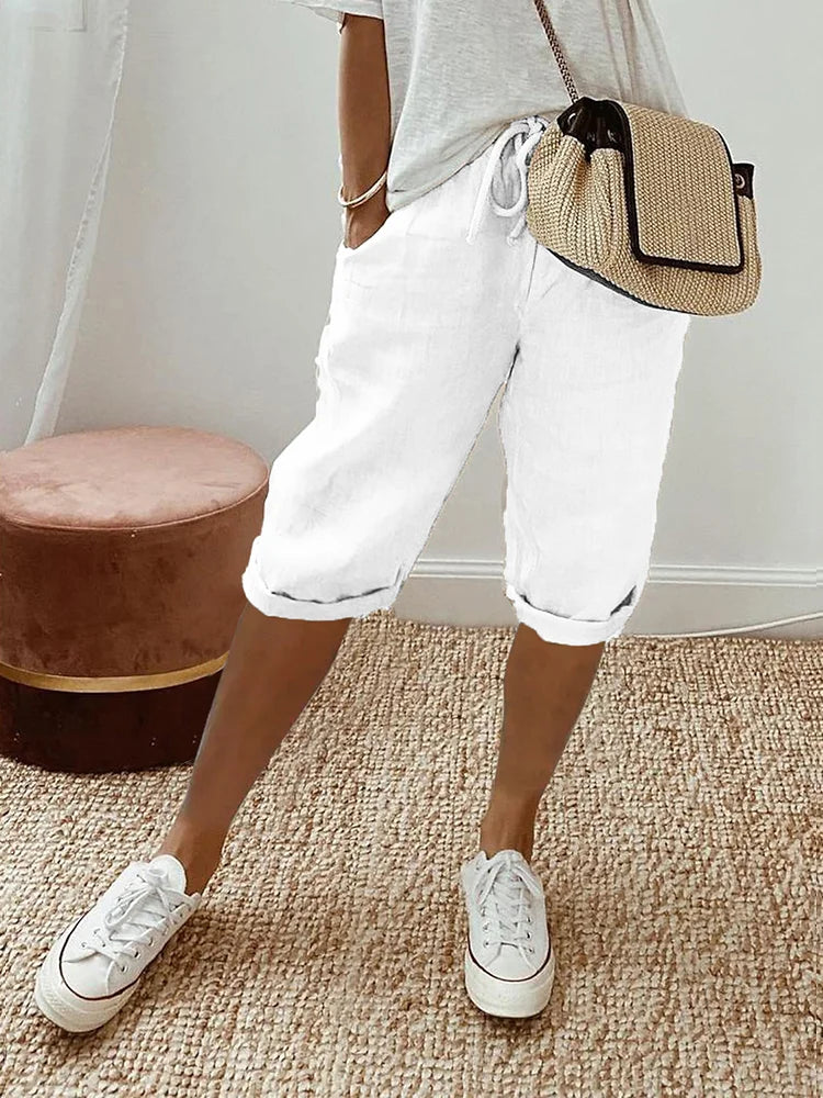 Close-up of women's breathable fabric knee-length pants, perfect for ultimate comfort & everyday summer wear.