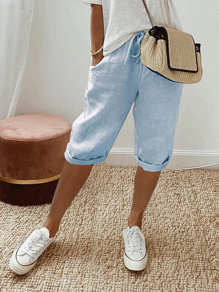 Comfortable women's knee-length pants for ladies, breathable capris with elastic waist & drawstring for daily wear.