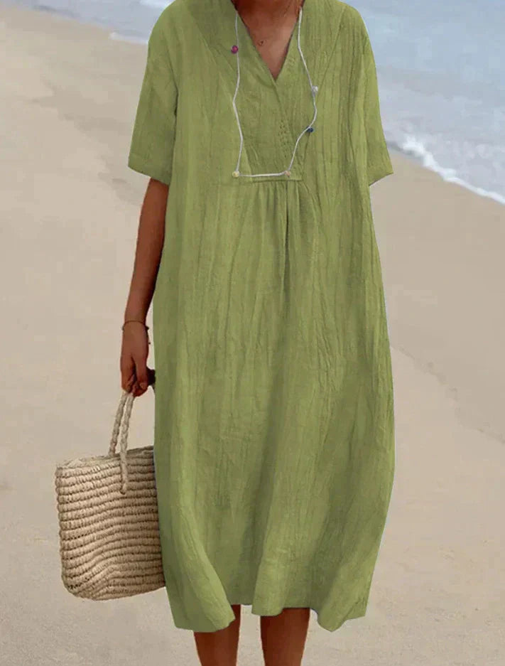 Lightweight women's A-line V-neck summer dress with practical pockets, ideal for comfort and style.