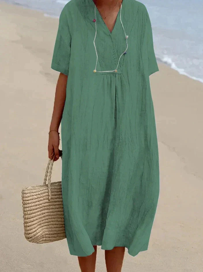 Aria women's cotton linen summer dress. Breezy A-line silhouette with a flattering V-neck, perfect for warm days.