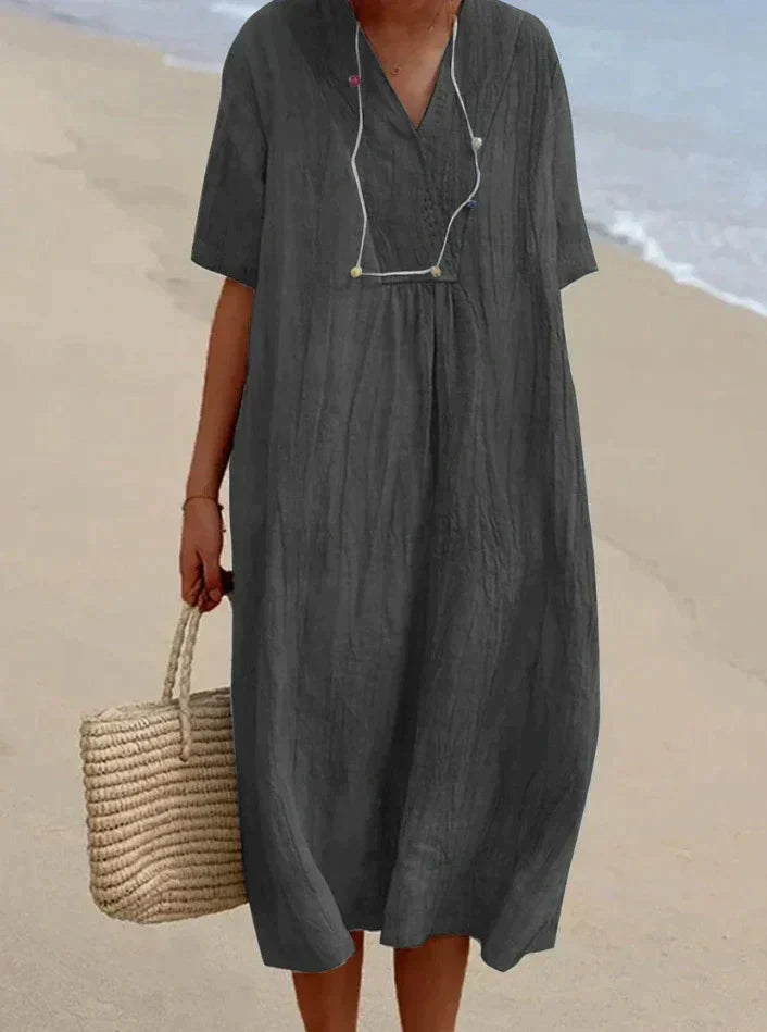 Comfortable women's casual summer dress. Cotton-linen blend with pockets, great for beach trips or relaxed outings.