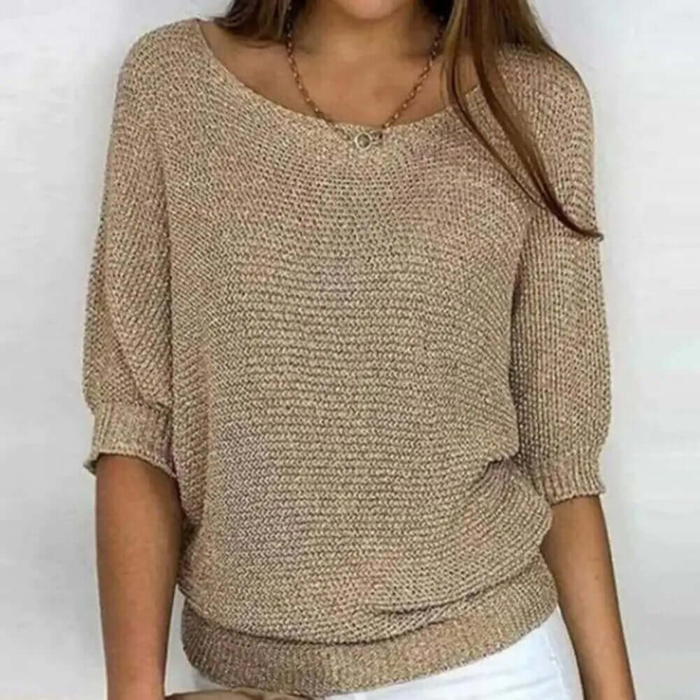 Stylish women's short sleeve summer knit jumper with round neck, offering a relaxed & chic fit.