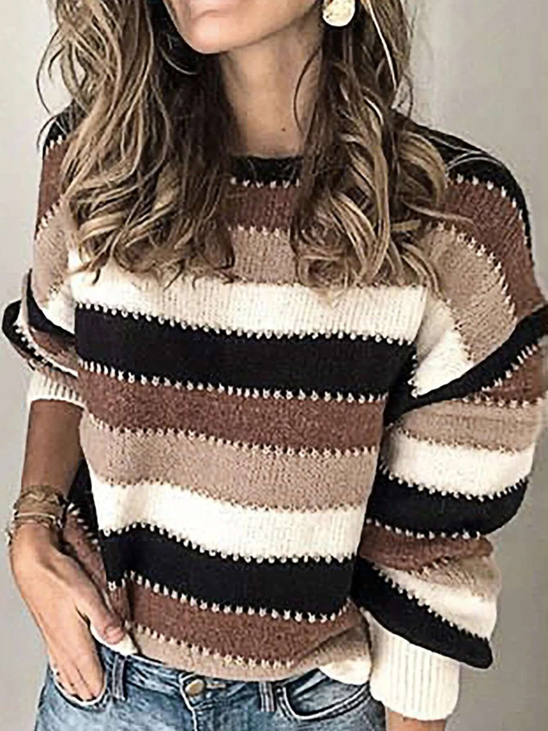 Cozy brown striped women's knitted sweater. Soft long-sleeve knitwear, ideal for effortless casual winter fashion.