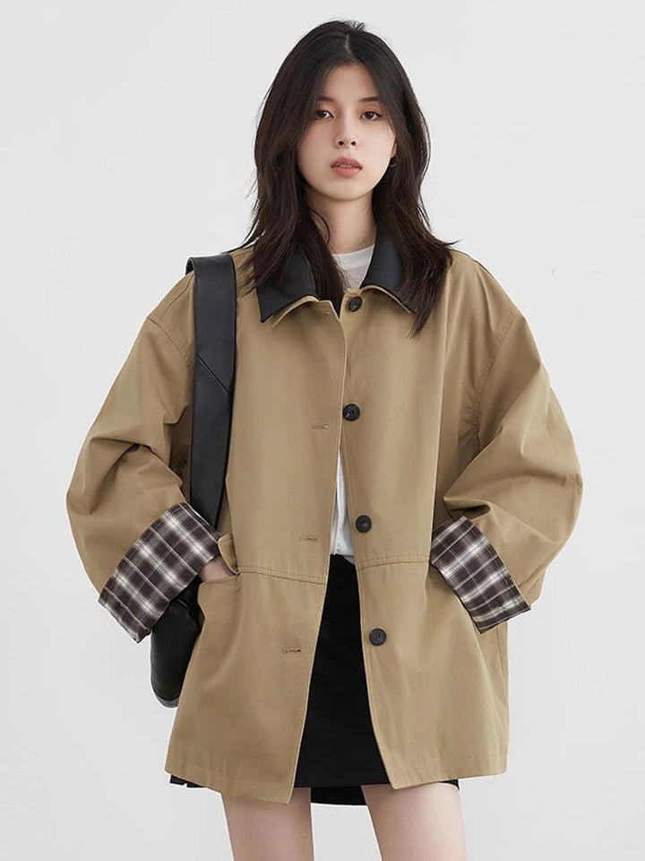 Stylish women's jacket featuring a button-up front and eye-catching contrast trim. Fall ready.