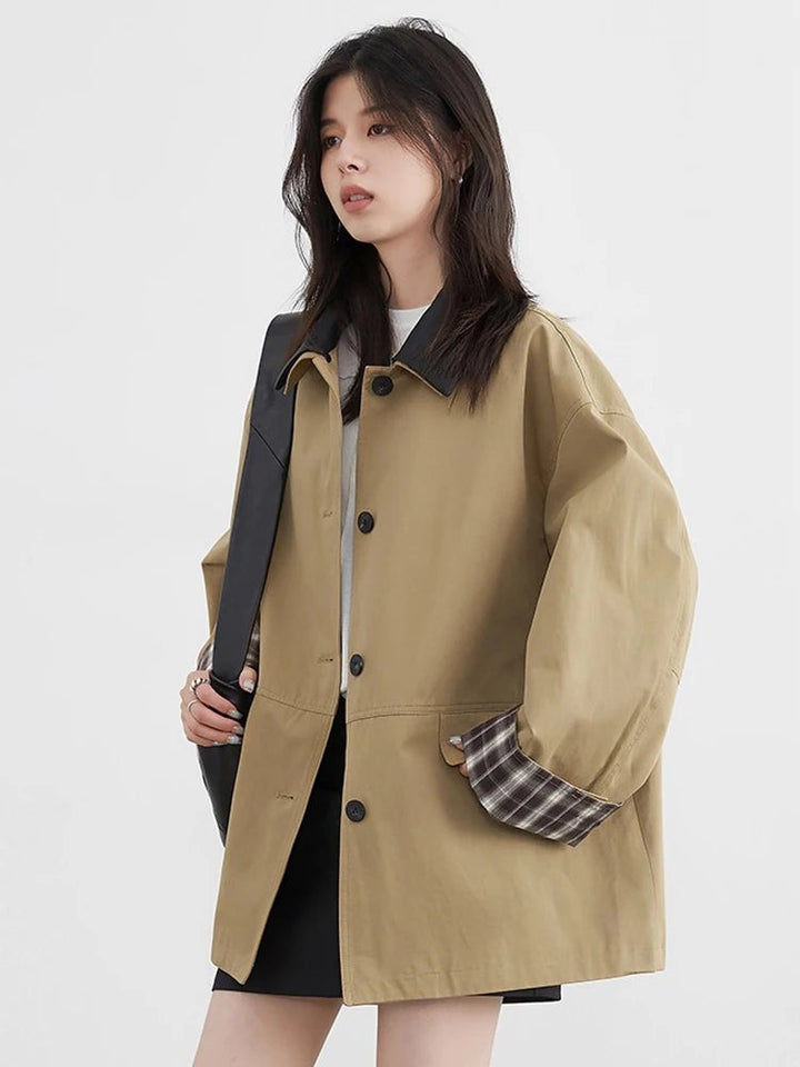 Lightweight women's outerwear, button-up closure and distinctive contrast trim. Everyday style.