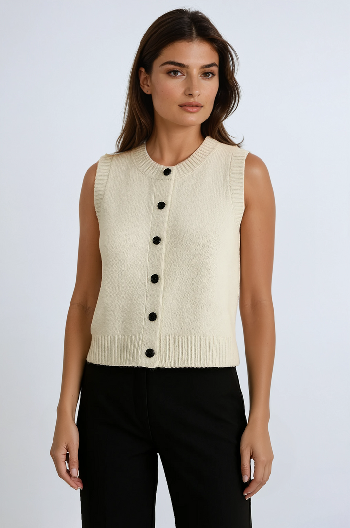 Women's button-up sweater vest for versatile layering. Sleeveless, chic fall & spring fashion.
