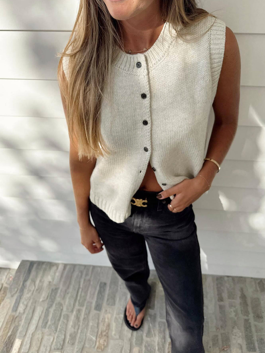 Light grey women's button-up sweater vest. Casual sleeveless top, ideal for spring & fall layering.