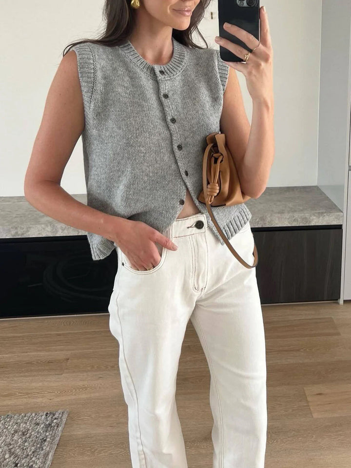 Women's versatile button-up sweater vest. Sleeveless, chic layering piece for fall, spring, casual outfits.