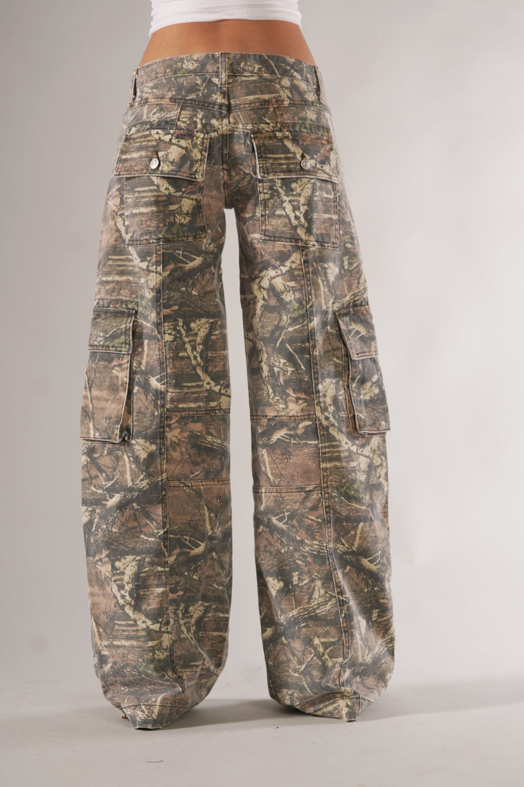 Fashionable women's camo cargo pants, comfortable wide leg design with practical utility pockets.