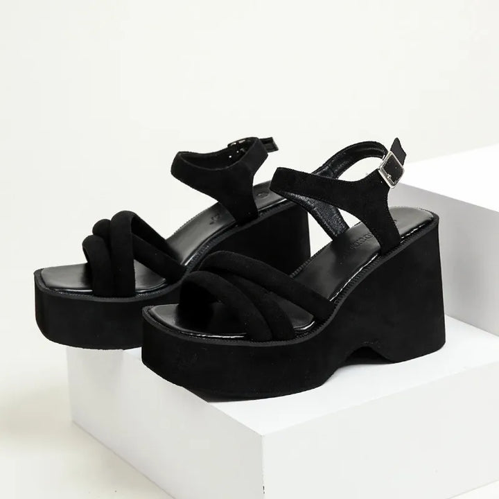 Women's Carmela black strappy sandals, offering elegant design & comfort for any occasion.