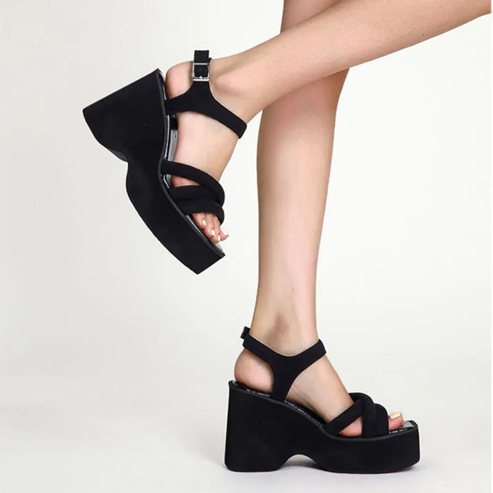 Comfortable women's Carmela black strappy sandals, versatile for dressy events or casual outfits.
