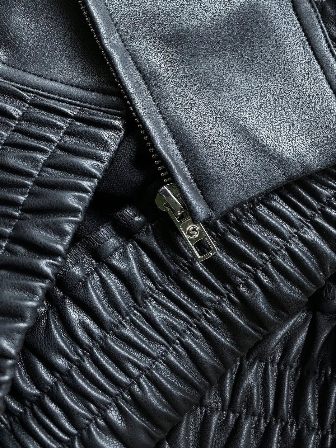 Women's stylish black jacket, perfect casual outerwear for a fashionable layered appearance.