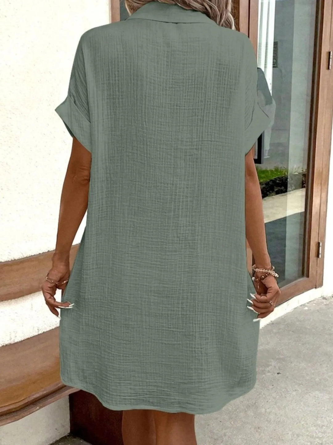 Trendy women's mini shirt dress, button-down, short sleeve, pockets; great for summer fashion.