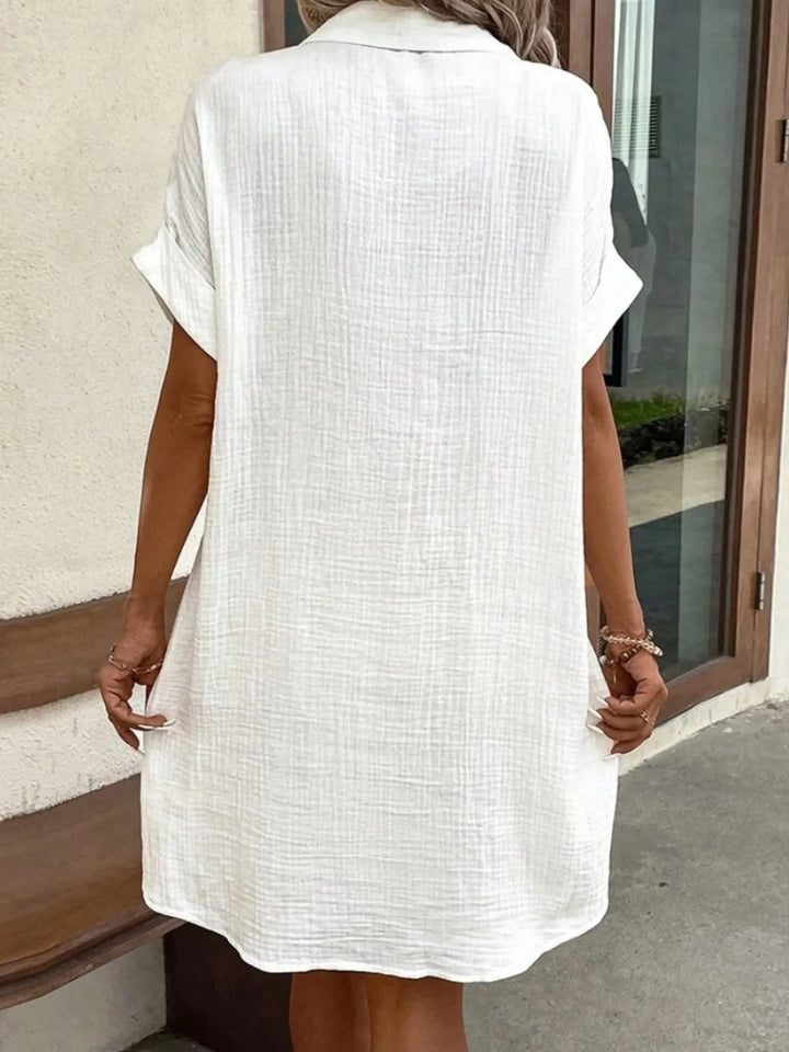 Comfortable relaxed fit women's mini shirt dress, button-down, short sleeves & functional pockets.