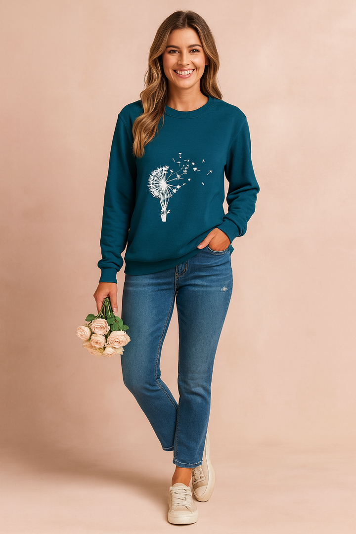 Relaxed fit women's dandelion print sweater. Comfortable crew neck, long sleeve top ideal for everyday casual wear.