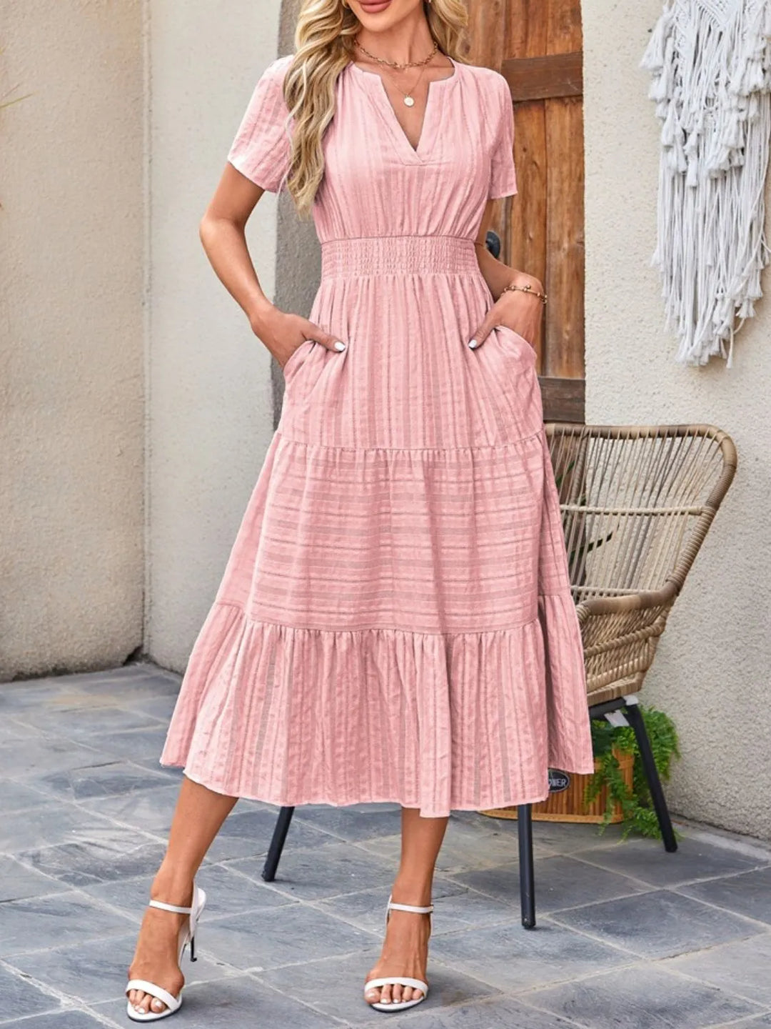Women's casual flowy midi dress with short sleeves & convenient pockets, perfect for summer comfort.