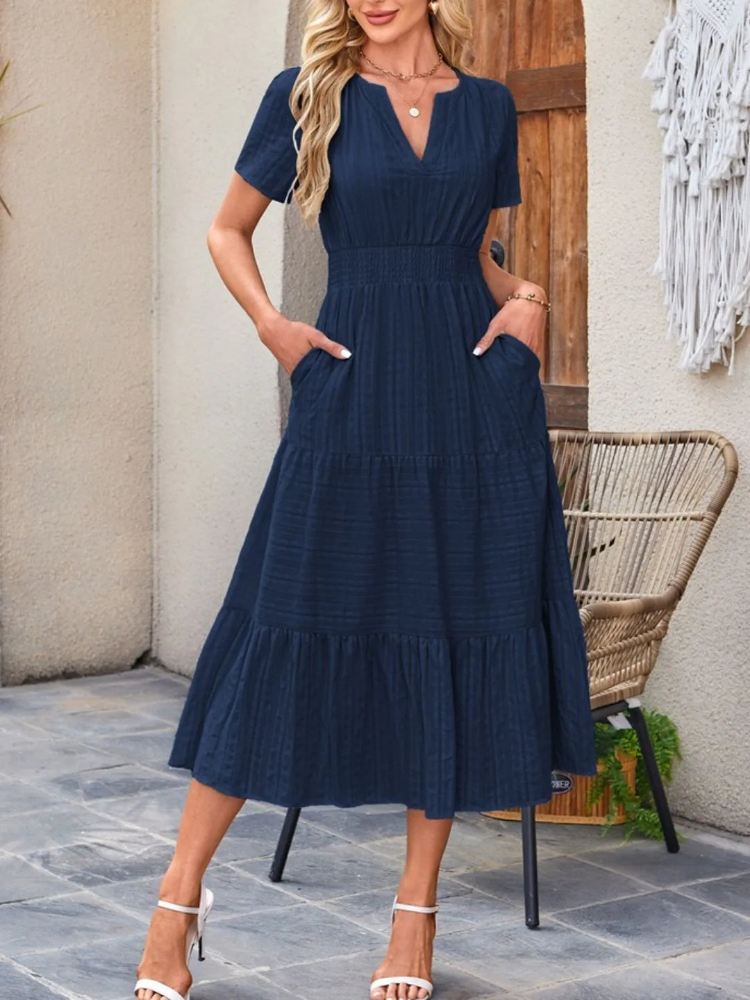 Breathable women's flowy summer midi dress, short sleeves, and practical pockets for convenience.