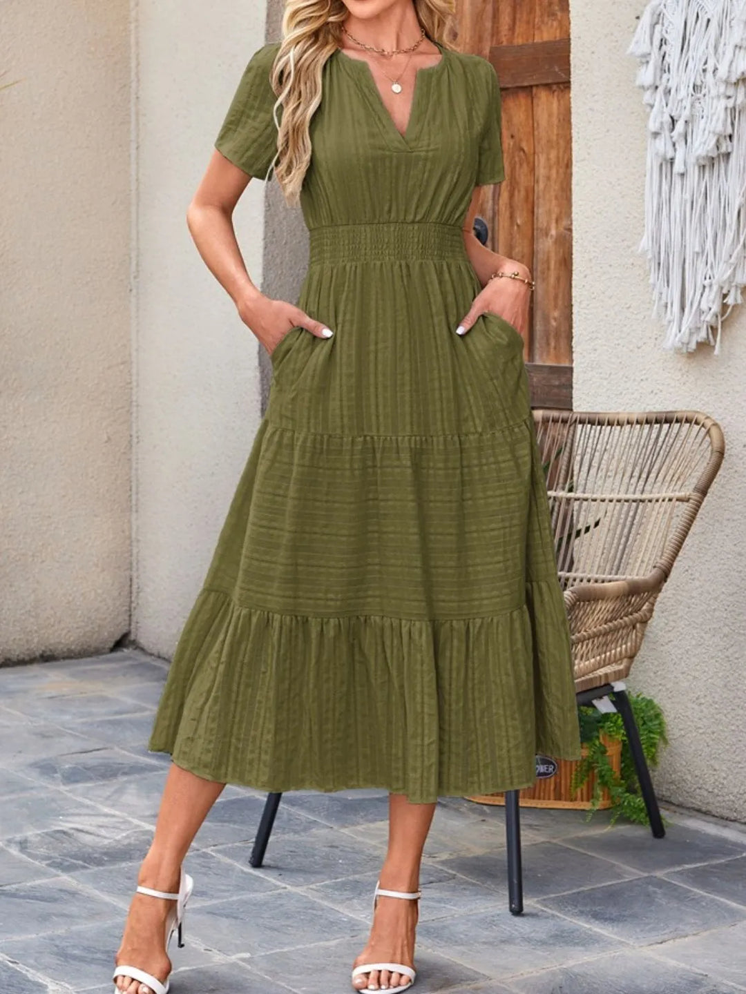 Feminine flowy midi dress for women, short sleeves, elegant tiered design, with pockets.