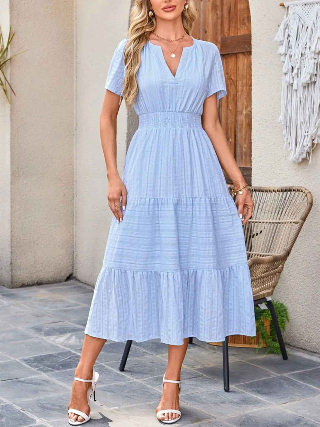 Relaxed fit short sleeve midi dress for women, ideal for casual wear, includes roomy pockets.