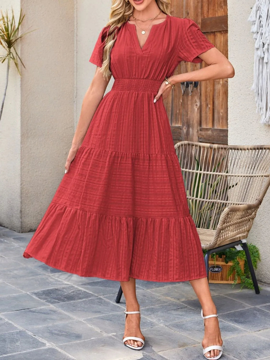 Women's short sleeve midi dress with a beautiful flowy drape and discreet, functional pockets.