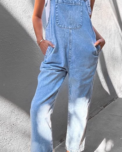 Comfortable women's blue sleeveless jumpsuit. Perfect for summer, this casual relaxed-fit one-piece features a practical front pocket.