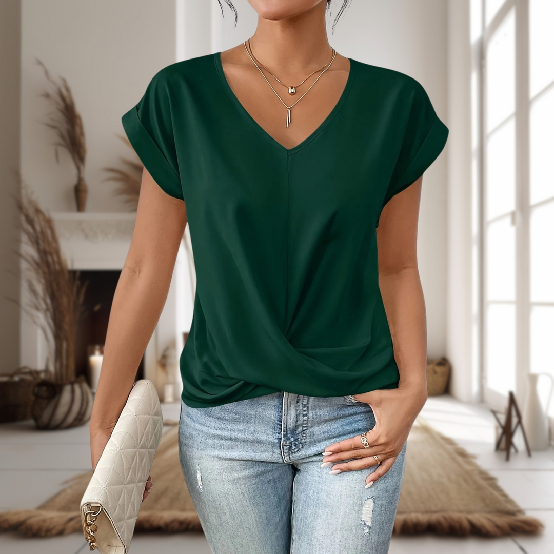 Woman wearing a comfortable short sleeve sweetheart neck t-shirt, perfect for a relaxed casual look.