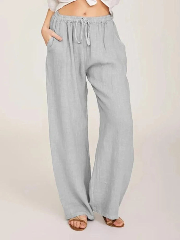 Loose-fit women's wide-leg pants with a comfortable drawstring waist, great for casual everyday wear.