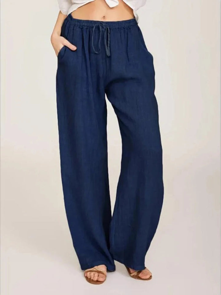 Relaxed fit women's wide-leg pants, offering ultimate comfort for casual or everyday outfits. Drawstring waist.