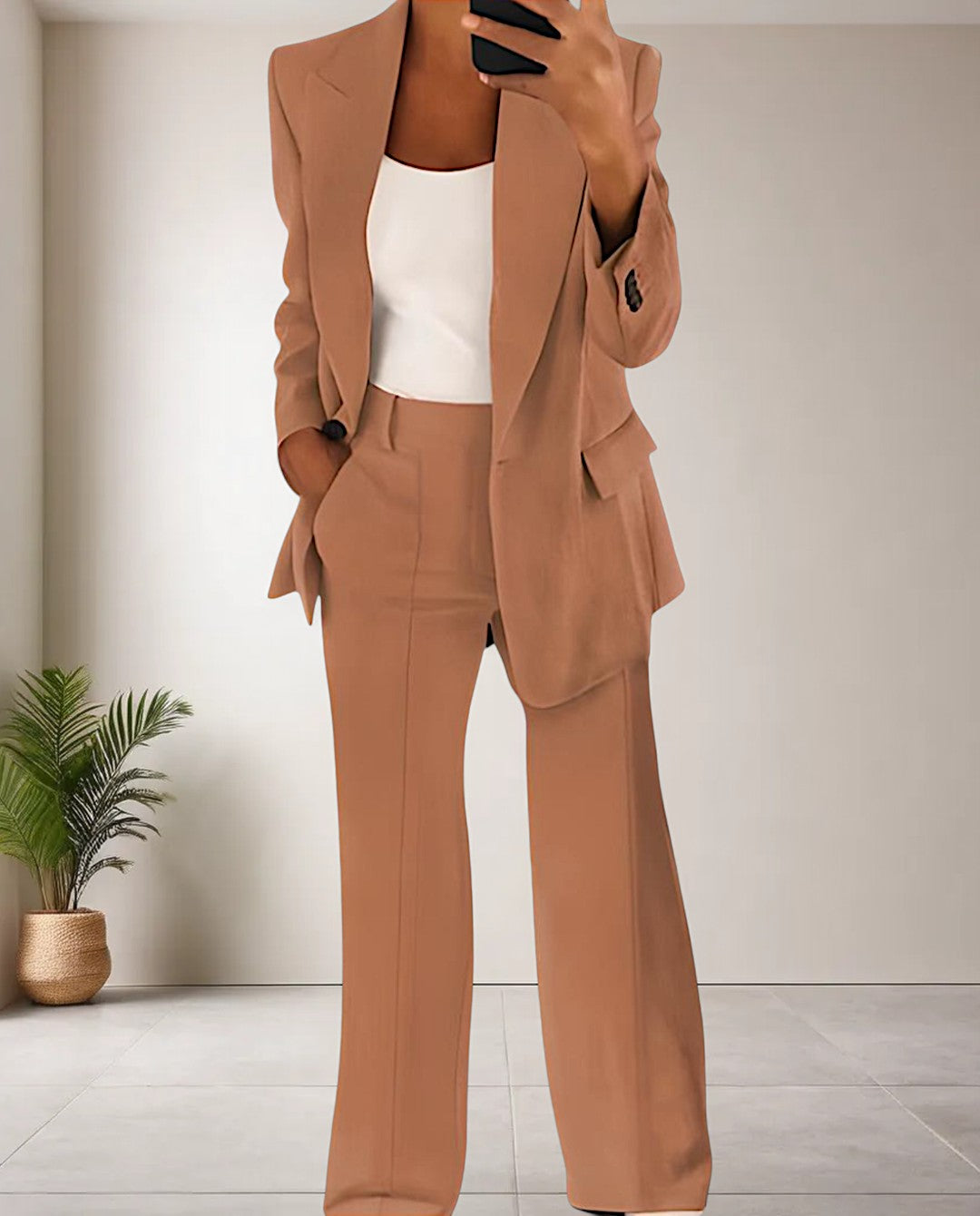 Modern Women's Isabella pantsuit featuring a chic blazer & tailored trousers, ideal for business wear or elegant fashion.