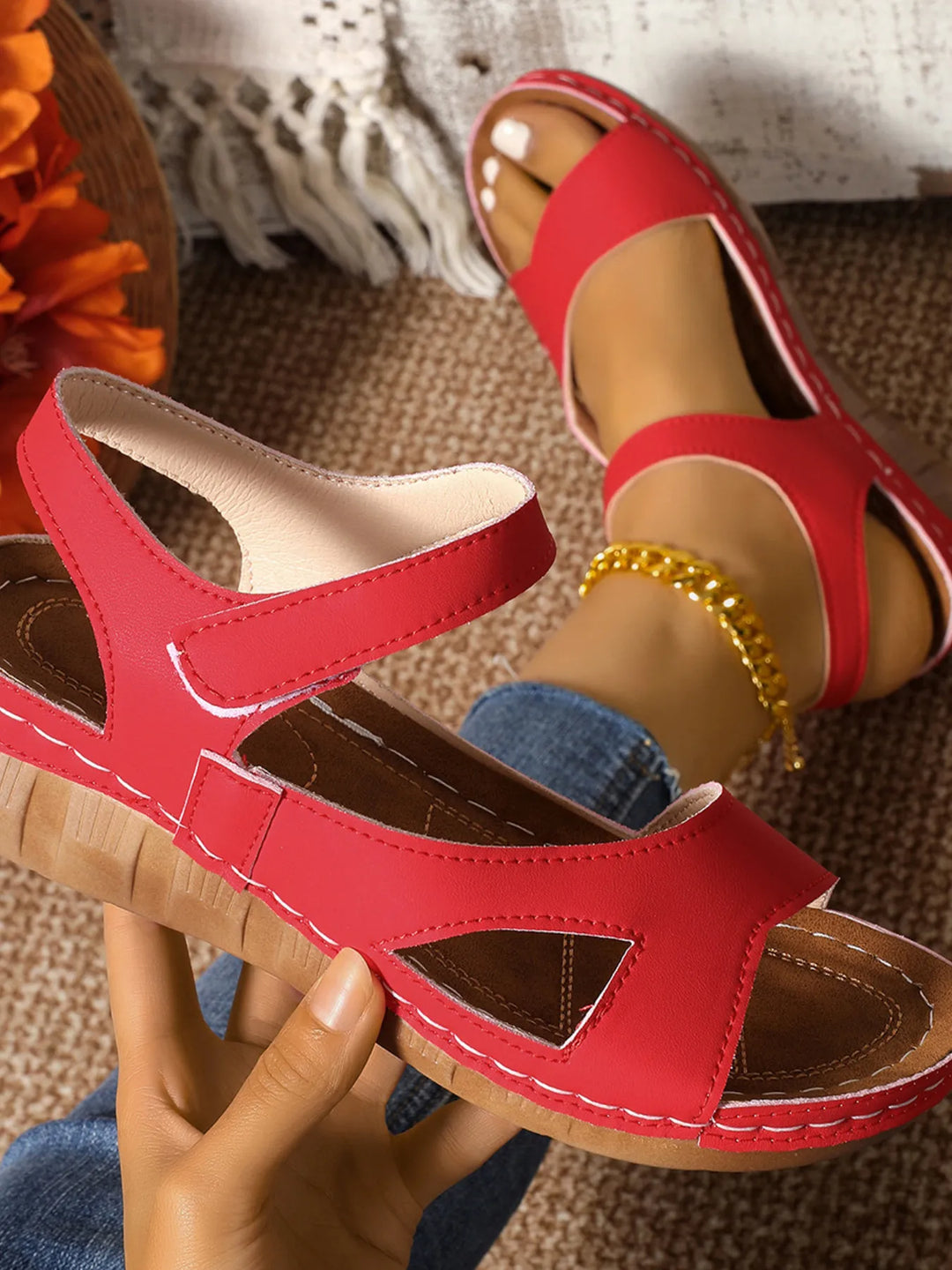Fashion-forward women's wedge sandals with an elegant ankle strap, perfect for a chic summer look.