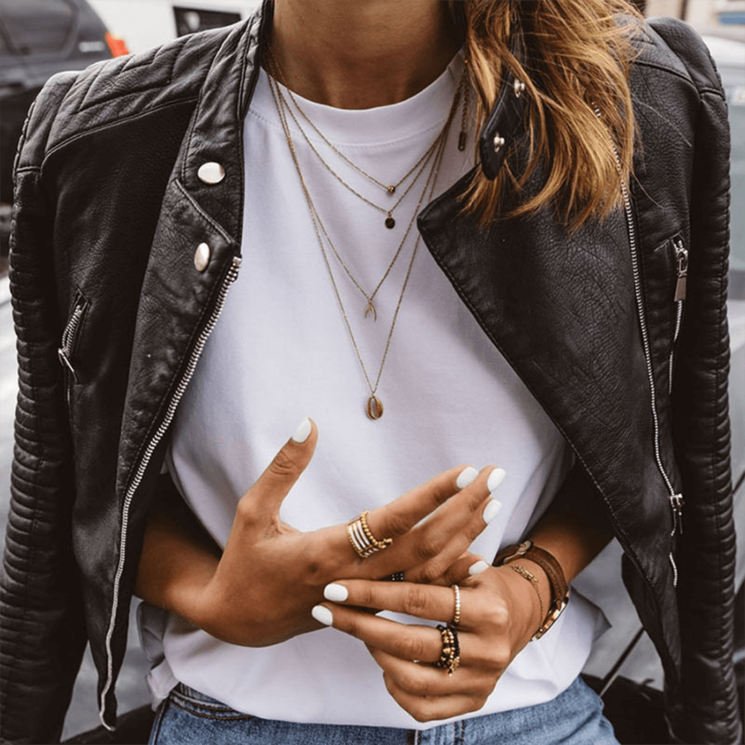 Stylish women's slim fit PU leather jacket. Black, chic outerwear perfect for fall fashion with a stand collar.