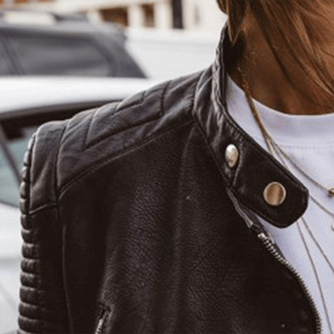 Elegant women's black PU leather jacket, slim fit, featuring a modern stand collar for chic winter wear.