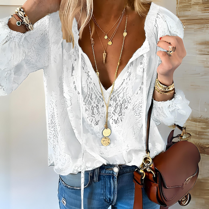 Boho chic women's crocheted blouse for effortless spring & summer style. Casual, relaxed fit top.
