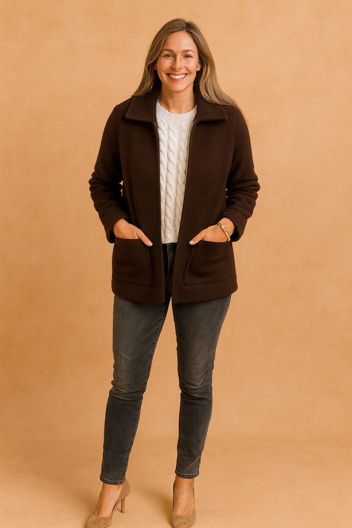 Modern women's chic cropped jacket with a zip closure and convenient pockets, great for casual urban fashion.