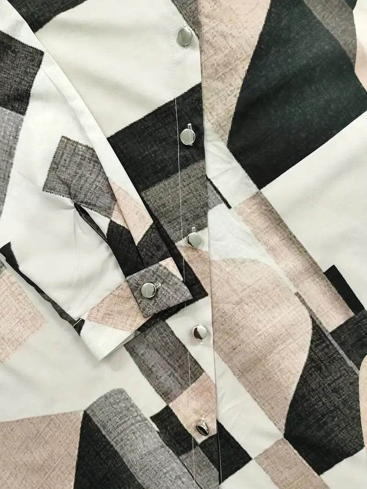 Elegant women's blouse: a long-sleeve button-up with a unique, eye-catching floral plaid print.