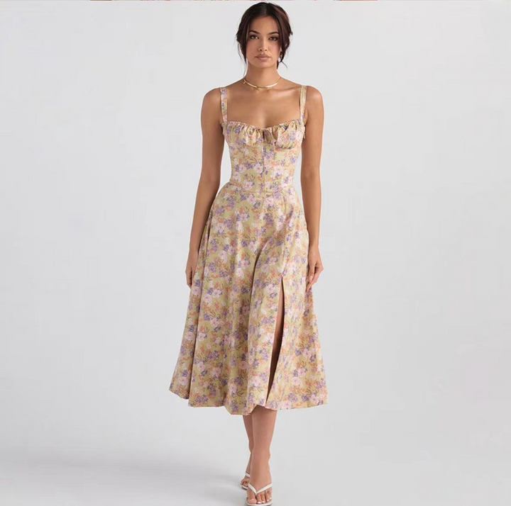 Chic women's floral midi dress with a sleeveless cut and playful tie front. Ideal for elegant spring/summer style.
